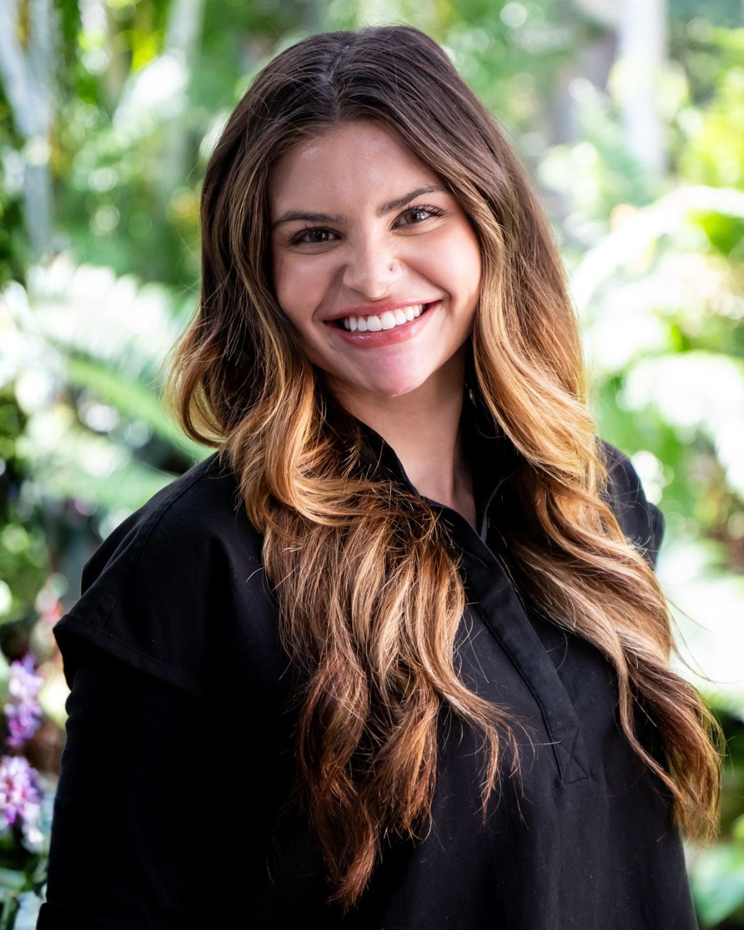 Portrait of a Laser Lounge Spa Estero team member in black scrubs